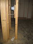 Downstairs one would go here, to the left of the door into the big storage closet