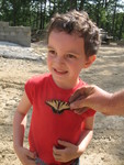 Connor found a dead butterfly. Jimmy held it up to have its pic taken with him
