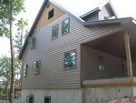 Nearly finished siding on the east end of the house