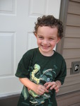Connor in his caterpillar shirt, holding the caterpillar