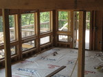 View of the deck and new rails through the dining room.