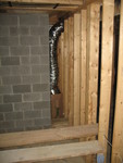 Duct for cool return air from basement to the upstairs air handler.  The grill will go between the masonry heater and the wall - a low-utility space anyway.