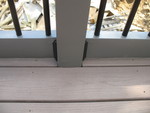 Detail of the black bracket and the trim used to cover the previously exposed wood