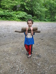 June 21: A-camping we will go!  Connor carrying firewood for our river-tubing campout