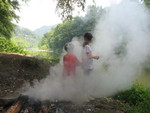 Kids 'helping' put out the fire (camera is suddenly clear again -- all of the mist here is smoke!)