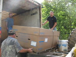 Bathtub being loaded on Jimmy's truck