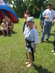 In harness, getting ready to climb the rock wall