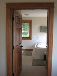 View into the master bathroom with 