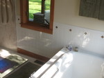 Rugs, towels, tub, and window