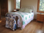 My bed, with the quilt rack grandma sent back with mom and dad on their last trip to IL