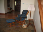 Rocking chair -- our primary nursing area.  The basket holds burp cloths, which has been a super-handy addition several times now!