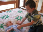He loves talking to her and trying to get her to smile for him (which she usually does!)