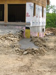 Footer for retaining wall next to driveway