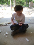 Connor with a dead lizard he found