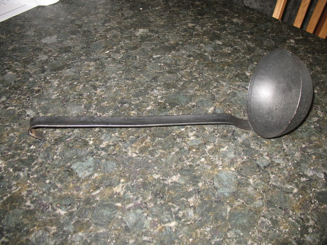 The cast iron ladle from the church rummage sale. The bowl is large enough that a single scoop would fill a large soupbowl.
