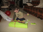 Opening his gift from Greg and Amy
