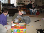 Opening his last present, from mommy and daddy