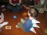 Dinosaur playing Go Fish with Uncle Greg and Aunt Amy