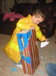 Opening his gift from Grandma Carolyn and PaChris