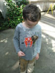 Connor had gotten quite wet at the shark-and-stingray tank,and this butterfly spent about 20 minutes on him drinking from his shirt