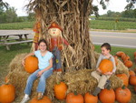 Next stop: the apple orchard. Kids posing with pumpkins