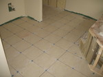 October 15: Main floor bathroom tile installed but not yet grouted