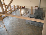 Main floor tile. Also notice the stovepipe added to the masonry heater