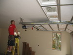 Guy installing the automatic opener