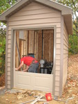Shed door being installed