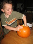 October 18: Connor cleaning seeds out of the pumpkin he picked out yesterday on his class field trip