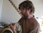 Don cornered him in the attic and threw a blanket over him to bring him out.  Don with owl in blanket
