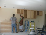 Kitchen cabinetry installation underway