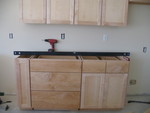Cabinetry that goes between the stove and the fridge