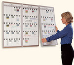 Alternative: neat 3-month idea for dry erase calendar. I'm thinking instead of the lift-and-move method, it'd be pretty easy to make some kind of a rail system where they just slide in and can be rotated more simply.